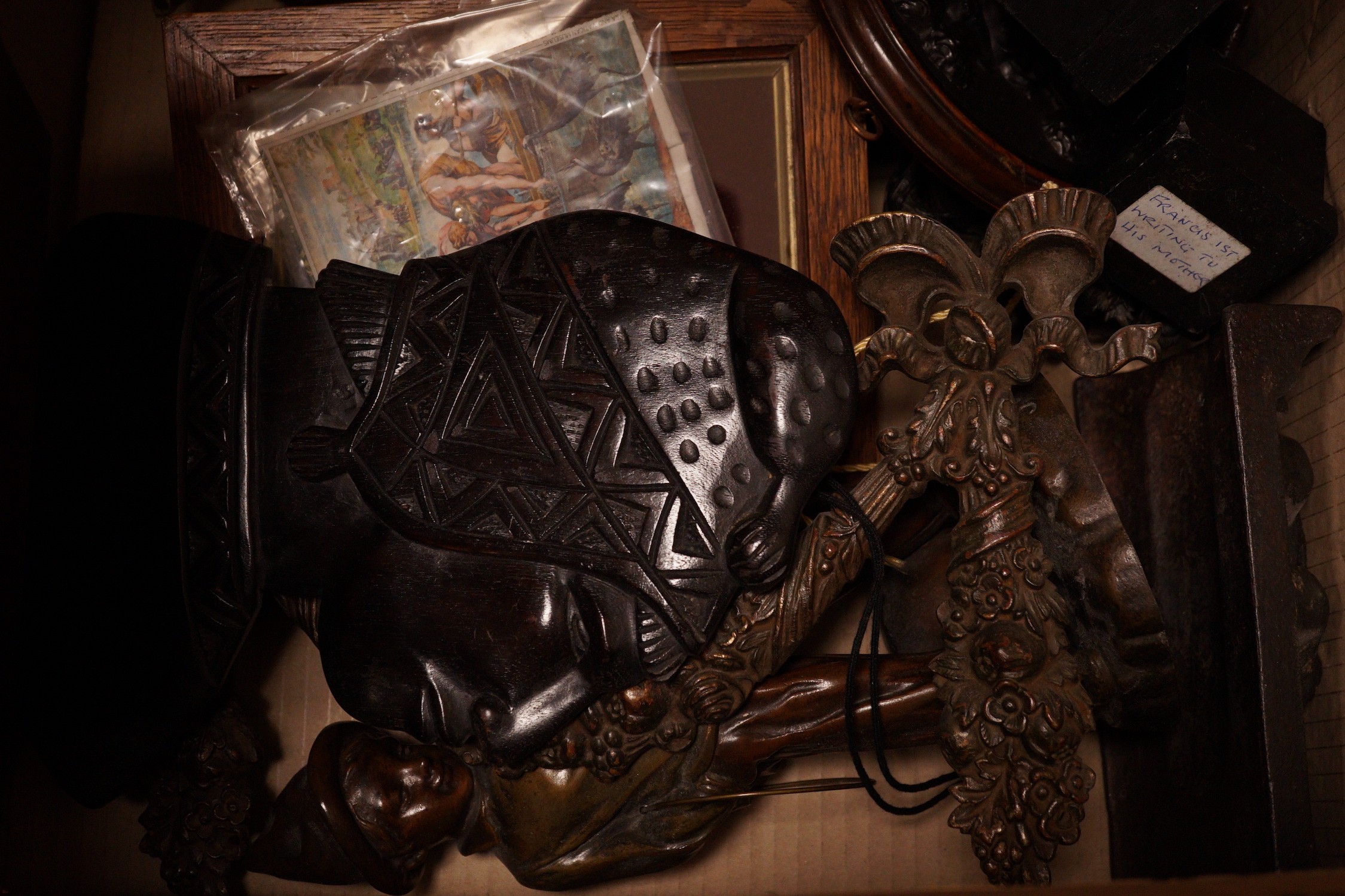 A mixed collection of decorative metalwares, including a gilt brass cherub plaque, a bronze figure of a boy cell signed L Grachner, a spelter figure of a Pierrot etc.